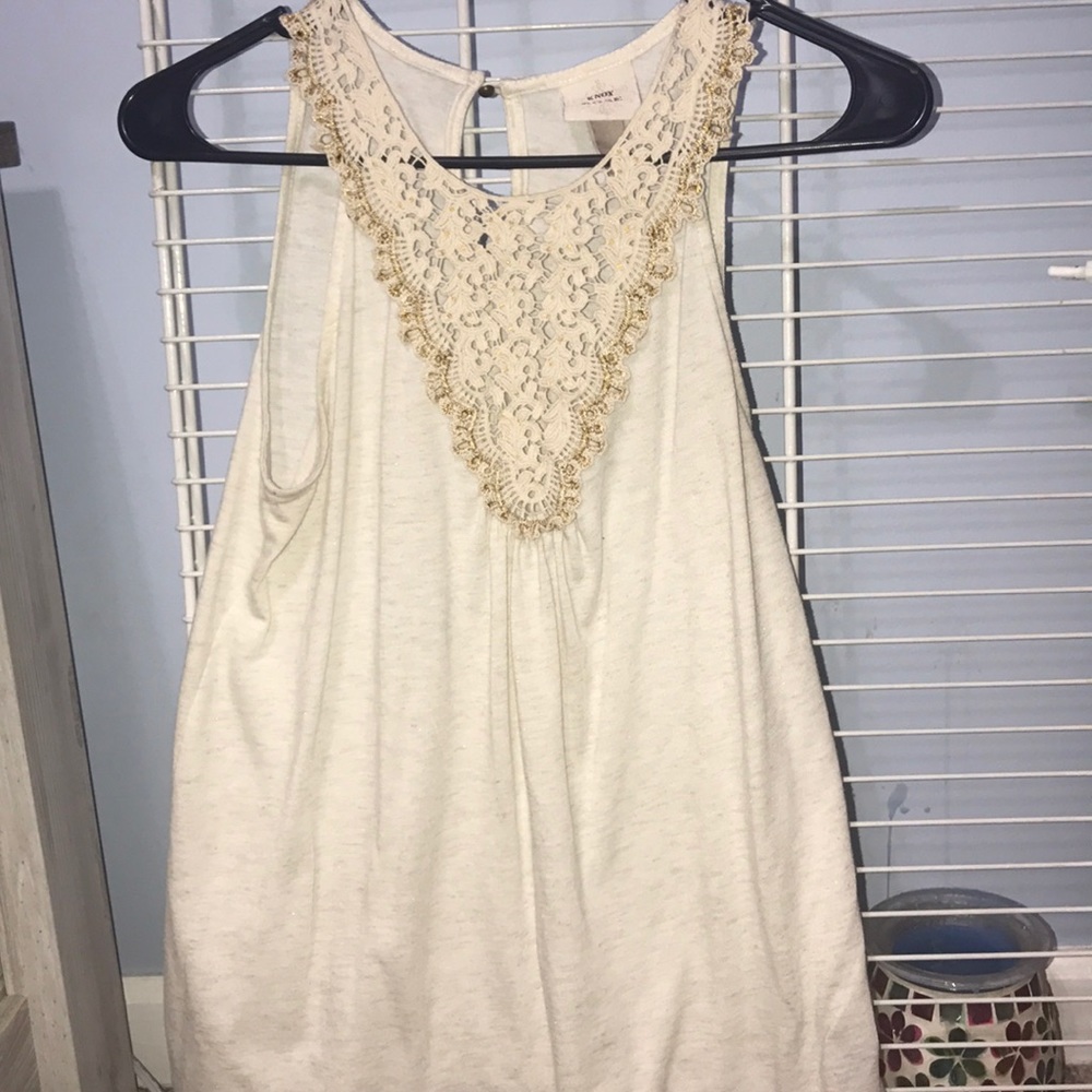 cream/shimmery tank